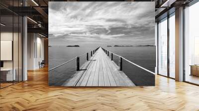 Black and white Landscape of wooden bridge in blue sea on tropical beach . Wall mural